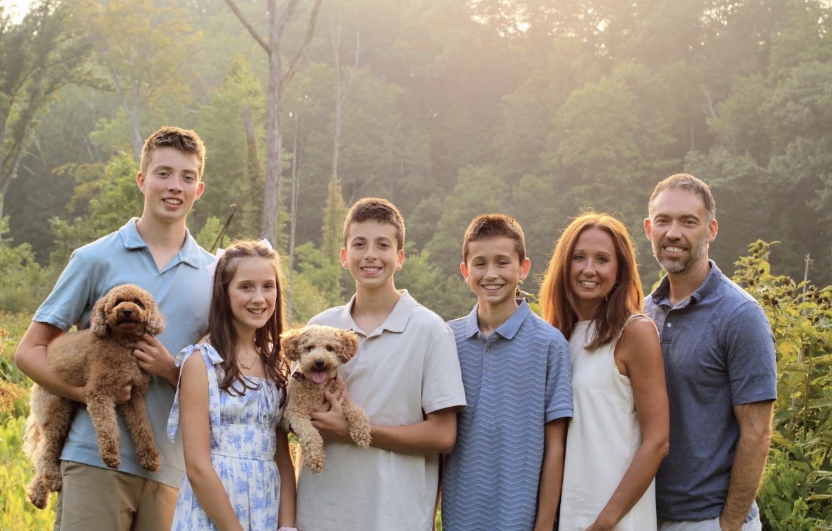 The M&M Doodle Pups family with their two doodles at home