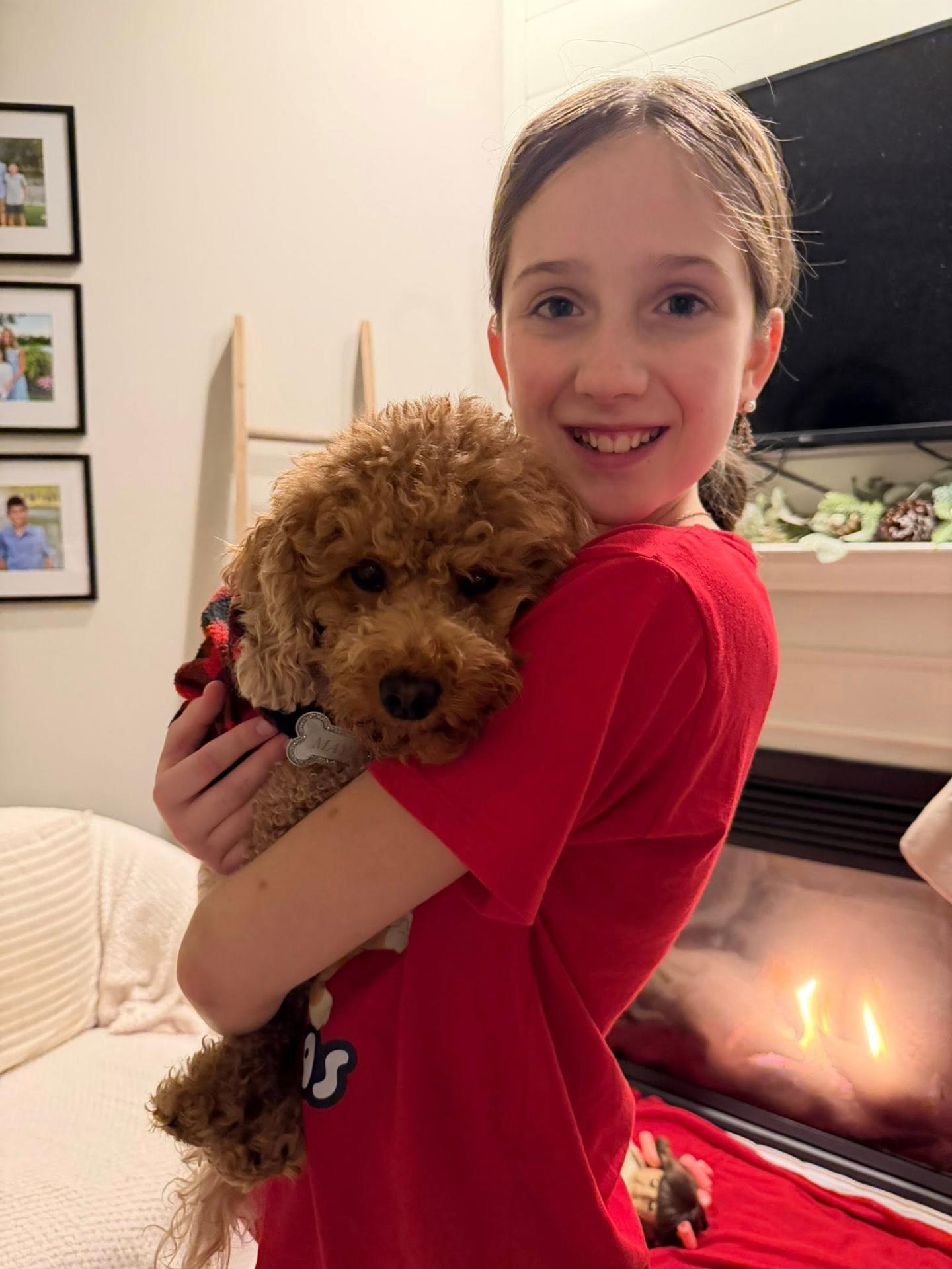 Our daughter cuddling Max